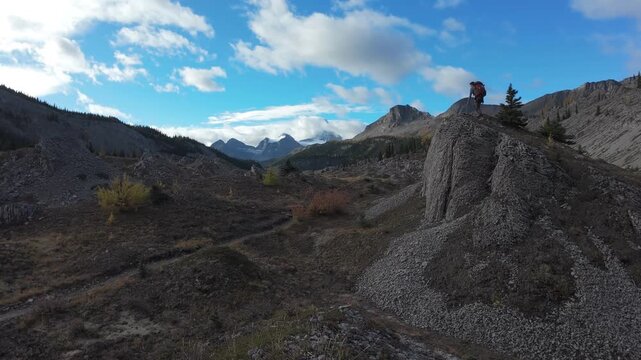 Hiker Overlooking Valley In Mount Assiniboine Provincial Park Canada