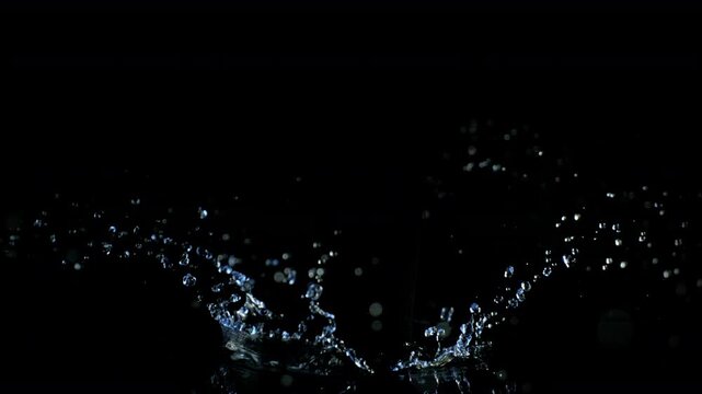 Super Slow Motion Shot of Water Crown Splash Isolated on Black Background at 1000fps.