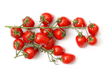 Obraz premium Cherry tomatoes on vine isolated on white background. Fresh red tomato bunch close up. Organic vegetables for healthy cooking and salad preparation. Natural food ingredient composition.