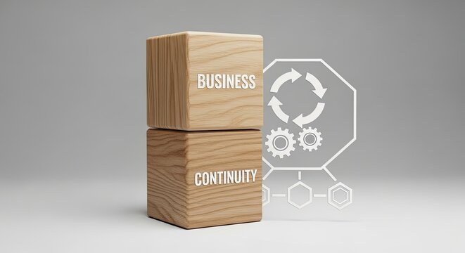 Business continuity concept with wooden blocks and gear icons on a gray background for corporate strategy and planning