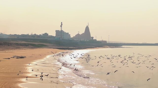 Aerial view of Somnath Temple in Gujarat, India, showcasing the grand coastal shrine dedicated to Lord Shiva. The image highlights the temple&rsquo;s majestic architecture and the Arabian Sea.