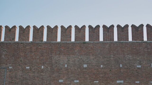 Ancient Brick Fortress Wall with medieval battlements in Venice Italy Close Up