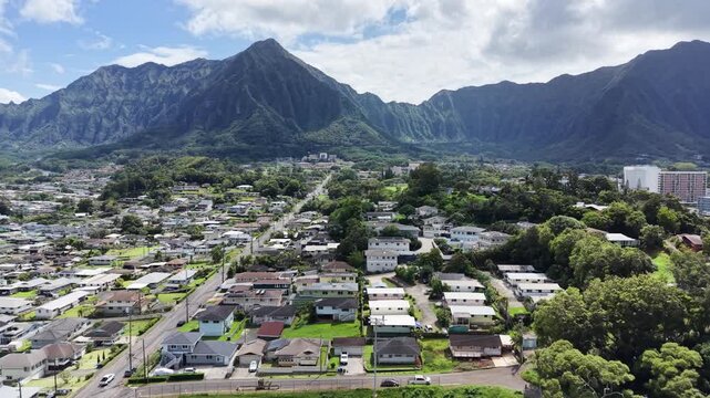 Residential neighborhood in the town of Kaneohe with the Koolau mountains on the east side of Oahu in Hawaii. 