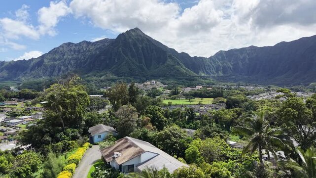 Residential homes in the town of Kaneohe with the Koolau mountains in the background on Oahu in Hawaii. 