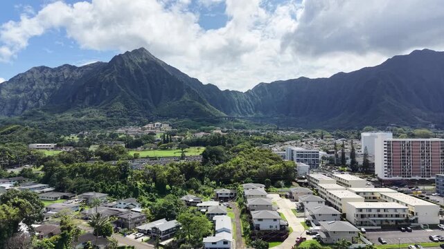 Residential homes and apartments in the town of Kaneohe with the Koolau mountains on the east side of Oahu in Hawaii. 
