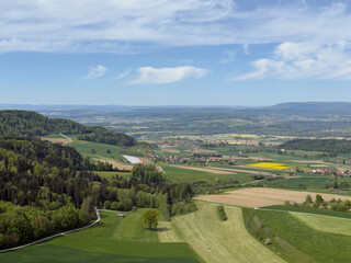 Naklejka premium Breathtaking Swiss Countryside Panorama With Lush Green Hills, Dense Woodland and Scenic Villages Beyond