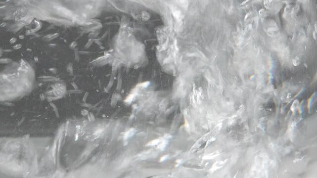 4K air bubbles forming and rising in clear water begins to boil, Physical transition of heating liquid.