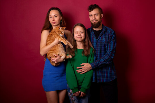 Family Portrait with Parents, Daughter and Orange Tabby Cat