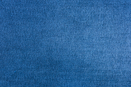 Text space created by blue denim texture on a fabric background for creative designs and simple layouts