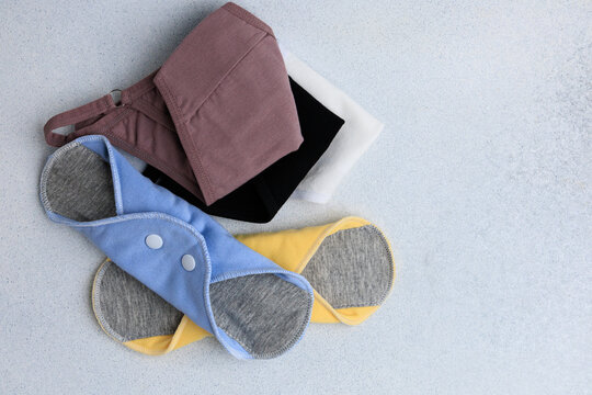 Different types of clothing items arranged neatly on a light surface for display or selection during a shopping event