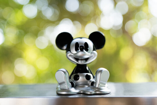 Bangkok, Thailand - May 11, 2026 : Pop Mart Silver Fluid Mickey Disney Mickey Boundless Creativity Series Figures on a nature background