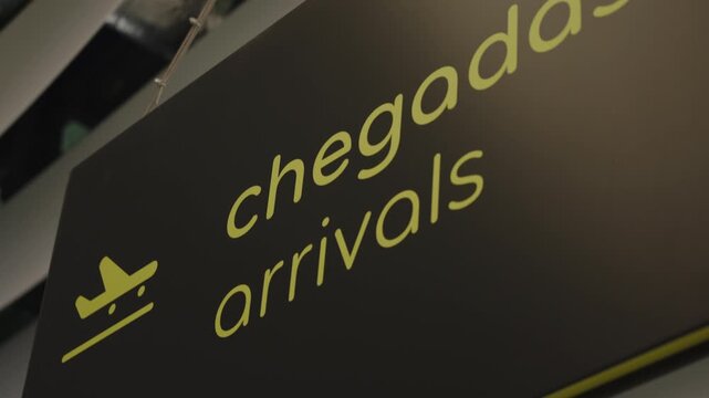 Cinematic Close-up of an Airport Arrivals Sign in Portuguese and English, Jo o Paulo II Airport