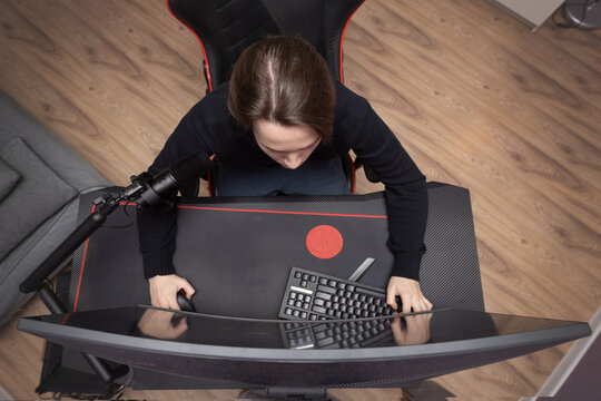 Top view of a handsome guy looking at a computer monitor.