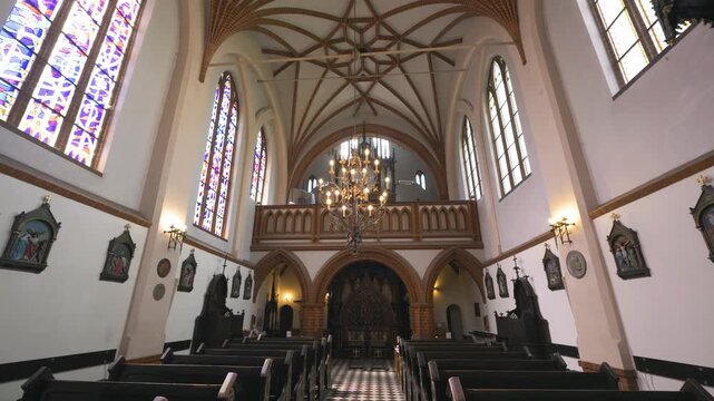 Vilnius, Lithuania &ndash; AMay 11, 2026: Smooth sliding movement inside St. Anne's Church featuring gothic interior architecture