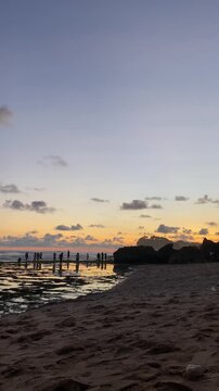 Group of Tourists Enjoying Sunset View on Exotic Coastline