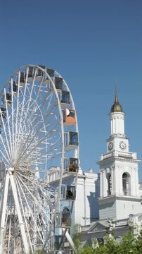 KYIV, UKRAINE - MAY 3, 2024: Ferris wheel at Podil square during daytime