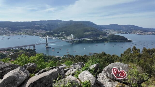 Rande bridge crossing ria de vigo with mussel farms from a viewpoint