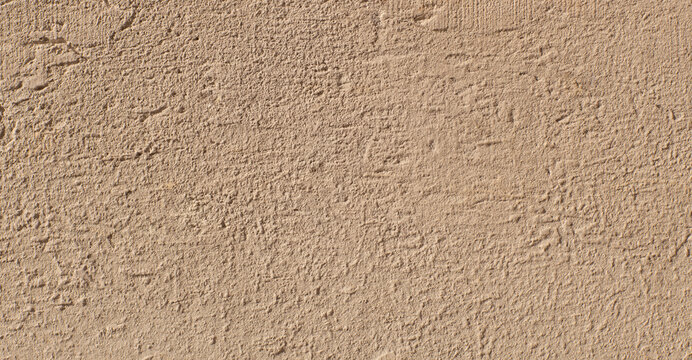 Beige stucco wall texture with rough plaster background