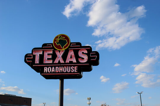 Close-up of a Texas Roadhouse sign, a popular restaurant known for offering hand-cut steaks, made-from-scratch sides, and freshly baked bread. (Minnesota, USA - May 8, 2026). Editorial Use Only.