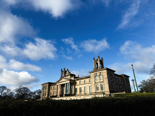 Naklejka premium Historic neoclassical Modern Two Dean Gallery museum building in Edinburgh, Scotland, UK with grand columns and towers under a bright blue sky
