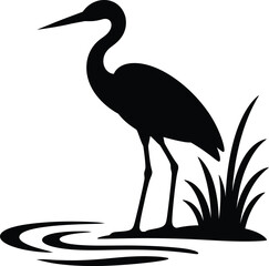 Obraz premium Silhouette of a heron standing in water with reeds