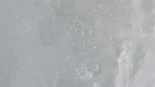 Bubbling and rippling water creates organic background plate
