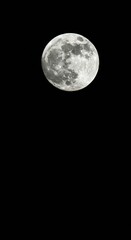 Obraz premium Large, bright full moon glowing brightly against a deep black, starry night sky. Perfect celestial backdrop for design projects, natural, celestial, overlay