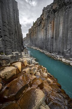 Stu&eth;lagil Canyon, turquoise river between basalt columns, Egilsstadir, Iceland