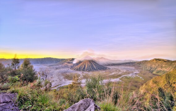 Sunrise, smoking volcano Mount Bromo, Mt. Batok at front, Mt. Kursi at back, Mt. Gunung Semeru, Bromo Tengger Semeru National Park, Java, Indonesia