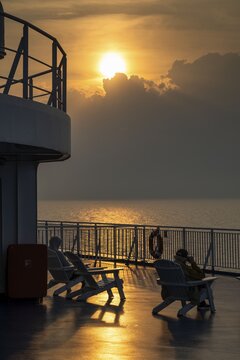 Travellers in deckchairs at sunset, Finland ferry Helsinki to Travem&uuml;nde, Baltic Sea