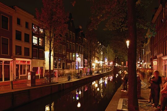 Night shot of the Oudezijds Achterburgwal in the red light district in Amsterdam, North Holland, Netherlands