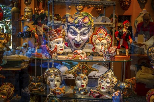 Venetian carnival masks in a shop window, Venice, Veneto, Italy