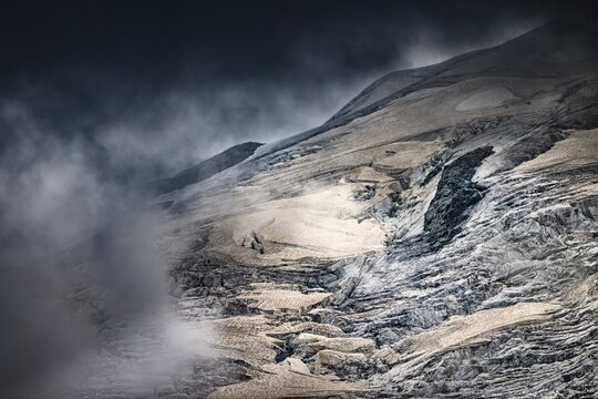 Bernina Group with Rosegg Glacier and dramatic clouds at blue hour, St Moritz, Engadin, Grisons, Switzerland