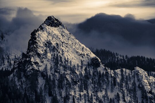 Snow-covered mountain peaks of the Bosconero group at blue hour, Forno, Val di Zoldo, Dolomites, Veneto, Italy