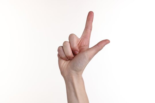 Woman showing number two with fingers on white background, closeup