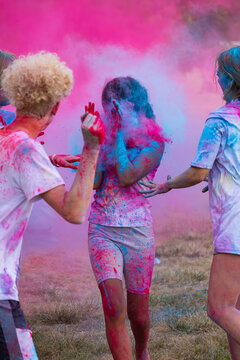 Kids throwing colored powder