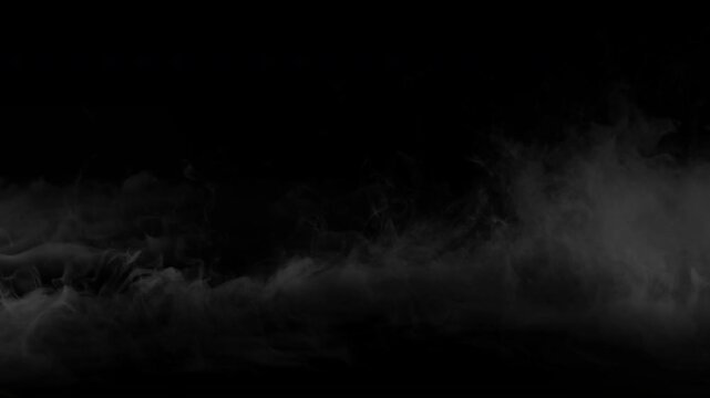 Ethereal white smoke clouds billowing and swirling in slow motion on a black screen.
