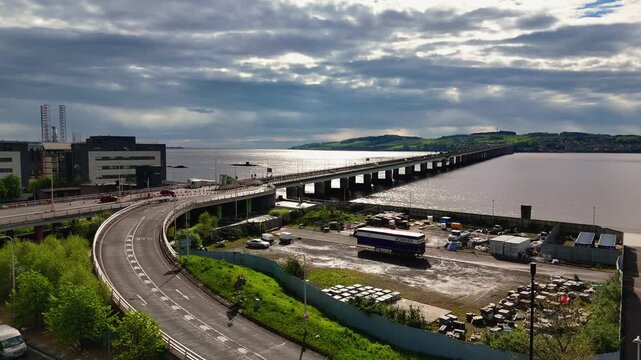Aerial Drone Approach of Tay Road Bridge and River Tay Waterfront in Dundee Scotland