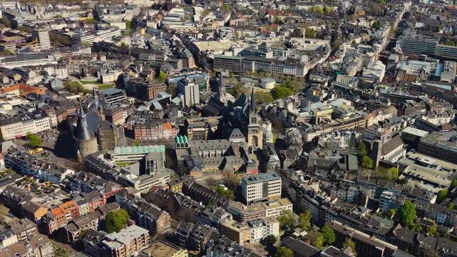 A panorama aerial view above the old town of the city Aachen on a sunny spring noon in Germany.