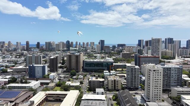 Aerial view looking across numerous apartments and condos towards the Ala Moana area of Honolulu on Oahu, Hawaii.