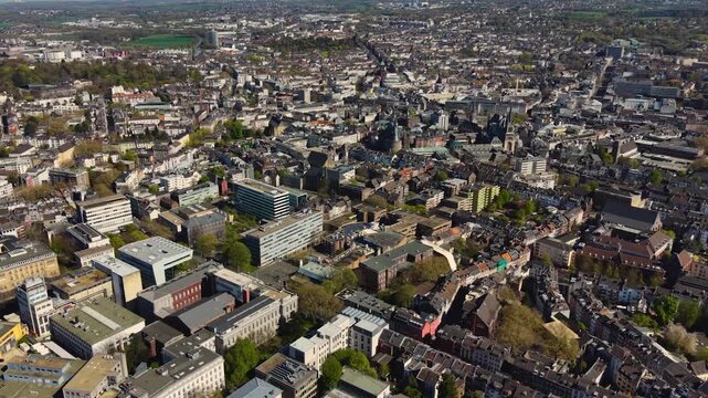 A panorama aerial view above the old town of the city Aachen on a sunny spring noon in Germany.