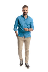 Fototapeta premium Confident smart casual man walking forward