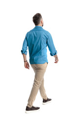 Fototapeta premium Back view of modern man walking away