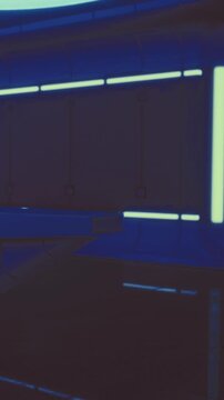 Bright neon lights illuminate an indoor area with sleek lines and modern features. The setting may be part of a creative workspace or an artistic venue. The atmosphere is vibrant and contemporary.