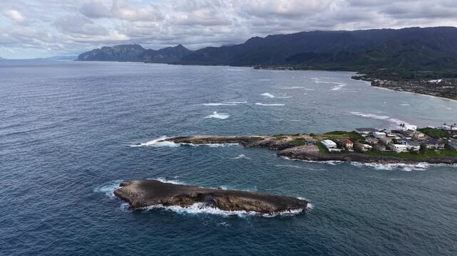 Aerial view of Laie Point and the Koolau mountain range in the background in northeastern Oahu in Hawaii. 