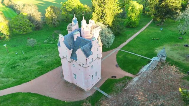 Cinematic Drone Shot of Craigievar Castle: Aerial View of the Pink Fairy Tale Fortress in Scotland
