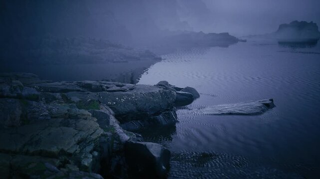 Foglaced inlet with distant rocks, low visibility silhouettes merge with sea, rippled surface adds texture, hushed palette suitable for mystery and ambient