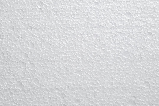 White polystyrene foam texture with porous surface and abstract bubble pattern.  Abstract minimal background for graphic design, overlays and creative design projects.