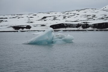 Small blue iceberg floating in the arctic ocean near Svalbard coast © rene_dra