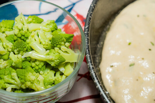 Sourdough focaccia dough proofing with romanesco side